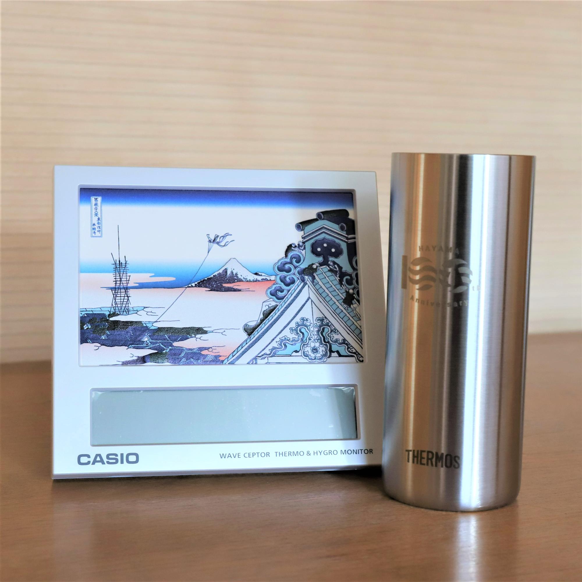 Casioのフォトクロックと葉山町制100周年記念タンブラー